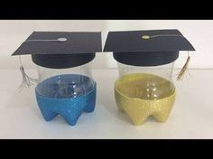 two plastic cups with graduation caps on them