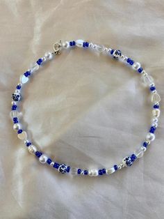 This beautiful blue beaded necklace is made with a variety of different types beads! No specific pattern so each necklace is different! This necklace is 15 inches long! Happy shopping Blue Beaded Necklace With Colorful Beads As Gift, Adjustable Blue Pearl Necklace With Polished Beads, Adjustable Polished Blue Pearl Necklace, Blue Beaded Necklace For Gift, Bohemian Blue Heart Beads, Blue Beaded Necklaces With Round Beads For Gifts, Blue Beaded Necklaces With Round Beads As Gift, Blue Beaded Necklaces For Gifts, Blue Beaded Pearl Necklace With Round Beads