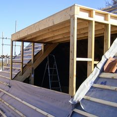 the roof is being installed on this house