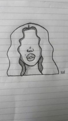 a drawing of a woman's face on lined paper