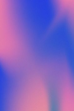 an abstract blurry background with pink and blue colors