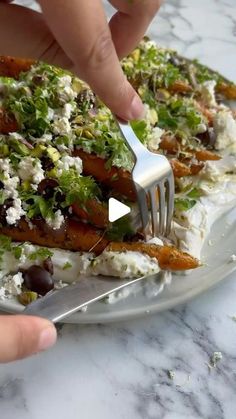 someone is cutting up food on a plate with a knife and fork to eat it