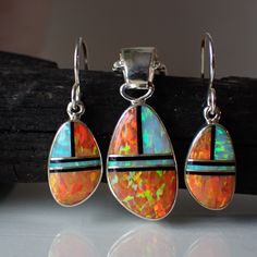 "This stunning sterling silver set is created and stamped by Navajo artist Sheryl Martinez. It features an inlay design of Opal. The earrings measure 1.2\" long including the ear wire by 0.4\" wide. The pendant measures 1.3\" long (from the top of the bail) by 0.5\" wide. This pendant comes on a sterling silver 1.5 mm rounded box chain." Southwestern Silver Jewelry With Inlay, Sterling Silver Artisan Jewelry With Inlay, Artisan Sterling Silver Jewelry With Inlay, Artisan Sterling Silver Inlay Jewelry, Sterling Silver Jewelry With Inlay, Artisan Teardrop Inlay Jewelry, Pendant And Earring Set, Inlay Design, White Opal