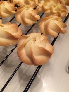 several pastries are cooling on a rack