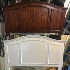 the headboard and foot board of a bed in a room with many clutter