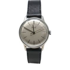 Piaget Classic Silver Dial Manual Wind Swiss Made 1950 Watch - 34mm Pre-Owned Sku: Pg-A0220p-C007 Product Description: Discover The Elegance Of The Piaget Classic Silver Dial Manual Wind Watch, A Swiss-Made Treasure From The 1950s. This 34mm Timepiece Features A Refined Silver Dial Head With A Number Dial, Encapsulating The Sophistication Of Its Era. The Manual Wind Movement Ensures A Connection To Traditional Watchmaking, While Its Antimagnetic Properties Offer Modern Functionality. Condition Report: This Watch Carries The Legacy Of Its Years, With Tarnish And Several Scratches Around The Gold Face That Narrate Its History. The Leather Black Band Complements The Silver Dial, Providing A Classic Silver Analog Watch Accessories, Timeless Silver Analog Watch, Classic Silver Watches With Metal Dial, Elegant Silver Watch With Analog Display, Elegant Silver Analog Display Watch, Elegant White Gold Watch With Analog Display, Elegant Silver Analog Watch, Elegant White Gold Watch Accessories With Analog Display, Timeless Silver Watch Accessories For Business