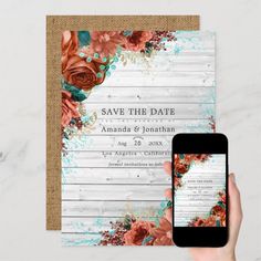 a person holding up a phone in front of a wedding save - the - date card