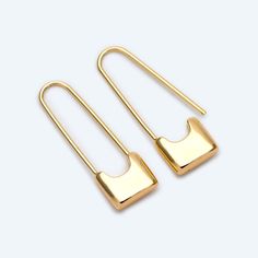 two pairs of gold - plated metal earrings with square shaped hooks on each end