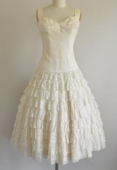 Vintage 1950s cream lace cocktail party dress. Tiered shelf bust, thick shoulder straps, fitted bodice with boning, dropped waist with tiered lace bottom. By Lilli Diamond. Available at SeaofVintage on Etsy. 1950s Style Tea Length Wedding Dress, 1950s Style Vintage Wedding Dress With Fitted Bodice, Cream 1950s Style Dresses, Retro White Vintage Dress With Lace Trim, 1950s Style Fitted Cream Vintage Dress, Cream 1950s Style Vintage Dress, 1950s Style Wedding Dress With Ruffles, 1950s Style Ruffled Wedding Dress, Diamond Wedding Dress