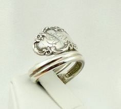 "Real vintage collectable sterling silver spoon ring with hand engraved \"B\" initial. Adjustable size. Marked \"Bridal Vail Sterling\". A great addition to your personal jewelry collection. FREE SHIPPING!! Details: Sterling Silver: (shown in picture) Ring Size: 5 3/4 (adjustable) Total Weight: 9.1 grams FREE domestic shipping by USPS Priority Mail delivery confirmation and includes insurance. If the item is to be shipped internationally Etsy will calculate postage. Please notify us at purchase Vintage Engraved Ring For Collectible, Vintage Personalized Engraved Ring For Collectors, Antique Sterling Silver Ring With Engraving Option, Antique Silver Engraved Sterling Silver Ring For Anniversary, Vintage Engraved Ring Stamped 925 For Gift, Vintage Silver Engraved Ring As Gift, Vintage Engraved Ring Stamped 925 As Gift, Vintage Silver Engraved Ring Gift, Vintage Silver Engraved Ring For Gift