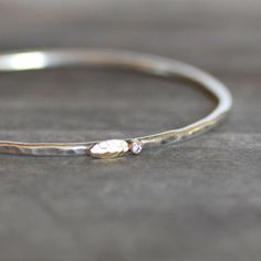 Diamond Leaf and Bud Bangle  Sterling and 18k by LilianGinebra, $179.00 Dainty Stackable Diamond Bracelet In White Gold, Dainty Stackable White Gold Diamond Bracelet, Dainty White Gold Stackable Diamond Bracelet, Diamond Bangle With Single Diamond For Wedding, White Gold Diamond Bangle With Single Diamond, Single Diamond Bangle For Wedding, Wedding Bangle With Single Diamond, Stackable White Gold Diamond Bracelet For Gift, Dainty Stackable Diamond Bangle Bracelet