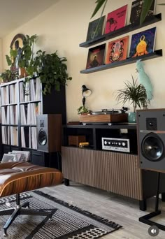 a living room filled with furniture and audio equipment