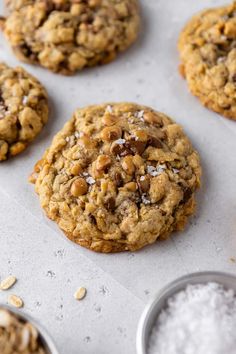 chocolate chip oatmeal cookies are lined up on a baking sheet and ready to be baked