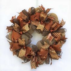 a wreath made out of burlocks and fabric