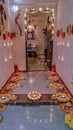 the hallway is decorated with candles and garlands for diwaling or decorating