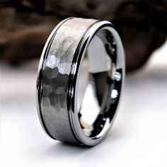 an image of a wedding ring that looks like it is made out of black and silver