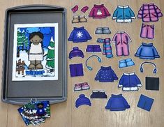 the paper doll is next to some cut outs for making snowsuits and clothes