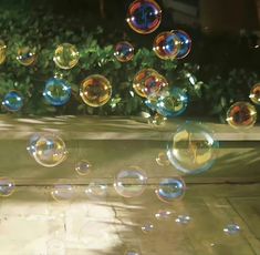 soap bubbles floating in the air on a patio