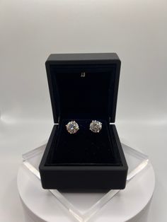 Introducing these breathtaking diamond studs set on 14Kt gold earrings.  Each is 2 carrots, for a total of 4 carrots. All orders come with screwbacks and a free battery-lit earring box similar to the ones photographed. Some of the Diamonds photographed are 2 Ct diamonds and some are 3 Ct diamonds. Actual size may vary. The Diamonds  Diamonds: 2 Lab Grown Diamond Weight: 2 Ct Each, Totalling 4 Ct Cut: Round Color: F+ Clarity: SI1+ Certificate: GIA/IGI The Settings  3 Prong Martini 14 Ct Gold in y