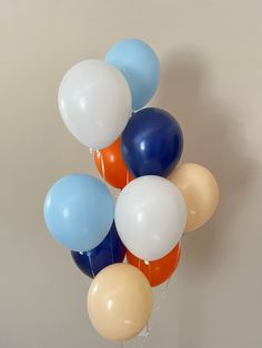 a bunch of balloons floating in the air