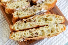 slices of bread sitting on top of a wooden cutting board