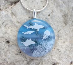 "This is a beautiful pendant created with pretty blue and purple art glass, and hand painted bubbles, creating depth and texture. The enamel ocean life scene is permanently fused to the glass. This pendant measures approximately 1.3\"(3cm)in diameter excluding the silver plated bail.The matching adjustable 16\"-18\"chain is included. If you would prefer a black cord instead,just let me know. Each purchase arrives in a pretty organza pouch. All of my jewellery is created in my home studio. Thanks Painted Bubbles, Gold Paperclip Necklace, Glass Shark, Cat Eye Jewelry, Ocean Pendant, Necklace Big, Peridot Necklace, Nephrite Jade, Purple Art