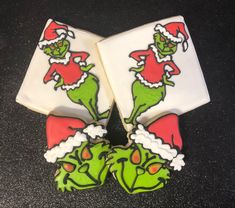 two decorated cookies sitting on top of each other