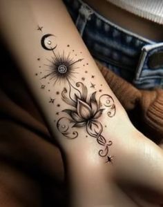 a woman's foot with a flower and stars tattoo on the side of her leg