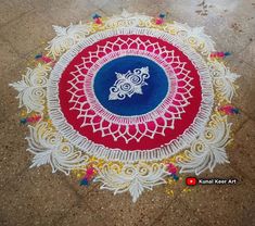 an intricately designed rangdi work on the ground