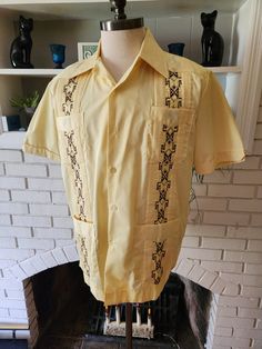 "Here is an amazing short sleeve shirt by Guayabera Don Romeo. 65% cotton, 35% polyester. Perfect yellow color throughout with stunning brown and yellow geometric designs on vertical striping down the front, three sewn in stripes down the back. Six button front, a pocket with a decorative button on each breast and each hip. Medium weight, soft and comfy. This is no doubt the finest of these shirts I've ever come across. It feels like it's never been worn. Super cool with tons of life left! The t Cabana Lounge, Kentucky Sweatshirt, Batwing Cardigan, Guayabera Shirt, Wedding Shirt, Large Wedding, Summer Surf, Handwoven Fabric, Mexican Wedding