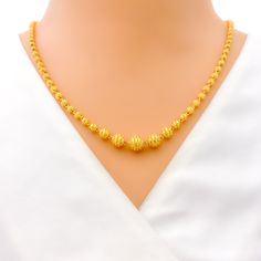 This exquisite 22k gold Lara necklace set, weighing 28.4 grams, features a radiant yellow gold finish and a striking striped design. The necklace measures 20 inches in length, with adjustable 0.6-inch links for a perfect fit. The set includes matching earrings, each 1.5 inches long with screw back posts and detachable hanging elements. Secured with a hook lock, this set is ideal for those who appreciate elegant and sophisticated jewelry, combining timeless beauty with a bold striped motif, making it perfect for any special occasion or stylish everyday wear. PRODUCT DETAILS Gold Purity(karat): 22k Gold Weight(grams): 28.4 Item Finish: Yellow Gold Necklace Length: 20" Adjustable Links: 0.6" Links Lock Style: Hook Lock Matching Earrings: Included Earring Length: 1.5" Earring Post: Screw Back Elegant Yellow Gold Chain Necklace For Festivals, Elegant 22k Gold Yellow Chain Necklace, Yellow Round Temple Jewelry Necklace, Festive Yellow Gold-plated Necklaces, Yellow 22k Gold Necklaces With Round Beads, 22k Gold Round Beads Yellow Necklace, Yellow 22k Gold Necklace With Round Beads, 22k Yellow Gold Round Beads Necklace, Yellow 22k Gold Round Necklace