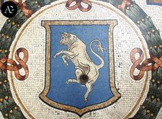 the coat of arms and lions are depicted in this mosaic