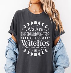 We Are The Granddaughters of The Witches You Couldn't Burn Comfort Colors® Shirt, Halloween Witch Shirt, Feminist Witch Shirt, Witch Tshirt  SIZING: These classic Comfort Colors® 1717 short sleeve t-shirts have a slightly relaxed, true-to-size fit. For a roomy fit, please order one size up. For an oversized fit, order one to two sizes up. (The models are wearing size XL for an oversized fit)  **PLEASE CHECK YOUR SIZE AGAINST THE SIZING CHART IN PHOTOS BEFORE PLACING YOUR ORDER** To check your si Halloween Cotton Tops With Text Print, Halloween Cotton Top With Text Print, Halloween Text Print Relaxed Fit Top, Halloween Relaxed Fit Top With Text Print, Relaxed Fit Halloween Top With Text Print, Halloween Cotton Slogan Top, Halloween Cotton Top With Slogan, Granddaughters Of The Witches, Witch Tshirt