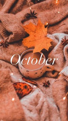 an autumn scene with the words october on top of it and leaves scattered around them