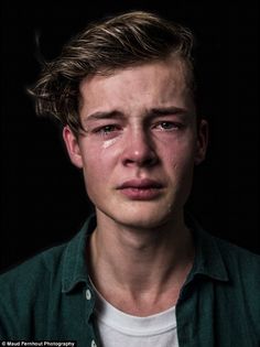 a young man with tears on his face