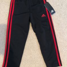 Adidas Boys 4 Black Red Stripe Sweatpants Nwt Red Sports Pants For Winter, Red Winter Sports Pants, Adidas Red Cotton Pants, Black Adidas Pants, Black And White Sweatpants, Adidas Bottoms, White Sweatpants, Black And White Pants, Striped Sweatpants