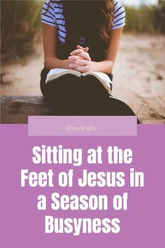 a woman sitting on the ground with her hands folded in prayer