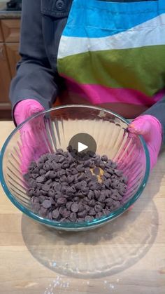 a person is mixing chocolate chips in a bowl