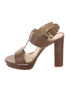 Michael Kors Leather T-Strap SandalsBrownPlatformStraps & Buckle Closure at AnklesUnfortunately, due to restrictions, this item may not be eligible for shipping in all areas. Brown T-strap Sandals With Ankle Strap, Brown T-strap Sandals With Strap Details, Brown T-strap Sandals, Formal Brown T-strap Sandals With Heel Strap, Elegant Brown T-strap Sandals With Ankle Strap, Elegant Brown T-strap Sandals With Buckle Closure, Michael Kors Formal Summer Sandals, Brown Leather T-strap Heels, Brown Strappy T-strap Sandals With Buckle Closure