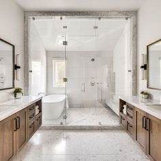 a large bathroom with two sinks and a bathtub