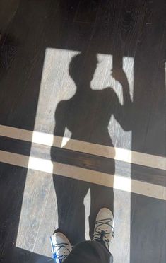 the shadow of a person standing in front of a door