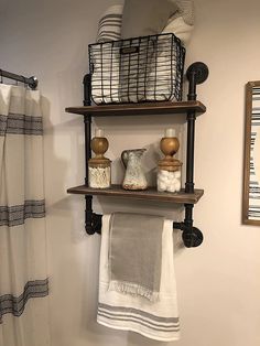 a bathroom with two shelves holding towels and other items