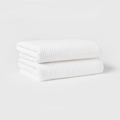 two white towels stacked on top of each other