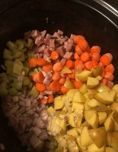 chopped potatoes, carrots and onions in a slow cooker