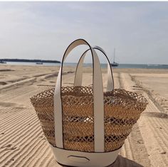 introducing the cannes tote! this is the perfect summer tote to wear daily! inspired by a vintage french straw handbag, we took our top-selling beach tote silhouette and gave it new life with an intricate lattice weave and luxurious leather trim. POOLSIDE bags are handwoven by female artisans in The Philippines, India, and Morocco, using natural materials and sustainable processes. This bag took over a week to create. Pool And Beach, Summer Tote, Beach Please, Straw Handbags, Swimming Outfit, Bag Boys, Beach Accessories, Monogrammed Items, Beach Tote