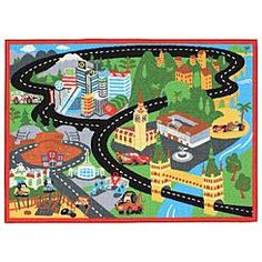 a child's play mat with cars and buildings on it, including a road