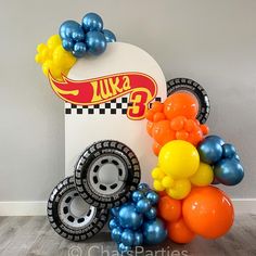 there is a bunch of balloons in the shape of cars