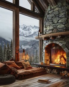 a living room filled with furniture and a fire place in front of a large window