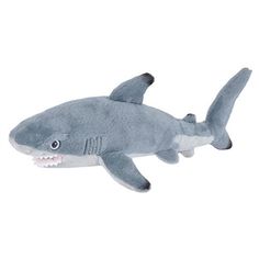 a stuffed shark with its mouth open on a white background