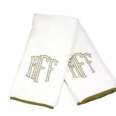 two white towels with monogrammed letters on them